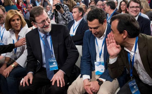 Cospedal, Rajoy y Moreno, durante la convención del PP en Sevilla. /EFE
