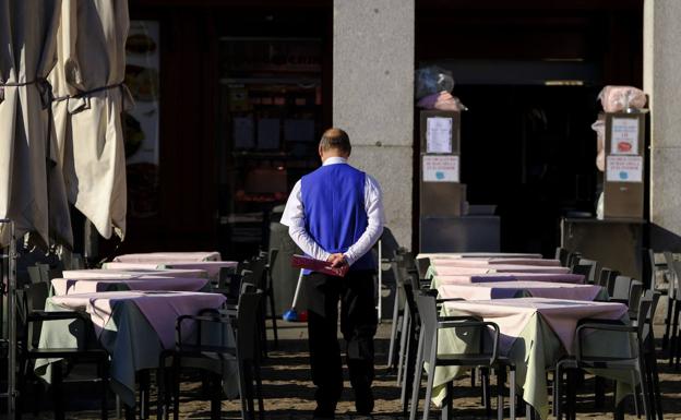 A waiter on a terrace in Madrid. 